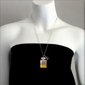 Chanel No 5 bottle necklace.